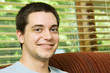 Photo: Teenage boy at home on the couch Teenage boy at home on the couch