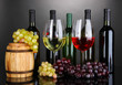 Assortment of wine in glasses and bottles on grey background