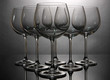 Empty wine glasses arranged on grey background