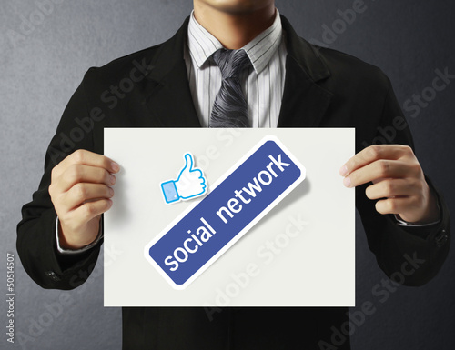 Photo: handing social network business card over handing social network business card over