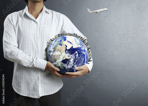 Photo: earth globe in his hands earth globe in his hands