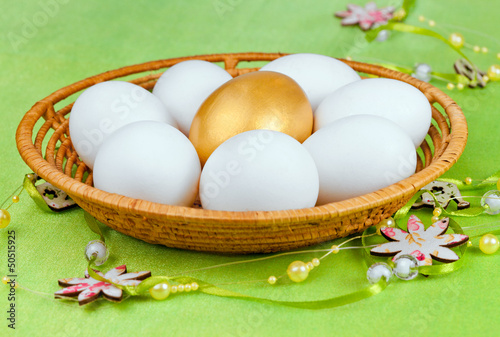 Photo: White and one golden Eggs White and one golden Eggs