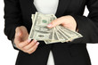 Woman recounts dollars, close up