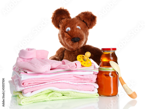 Photo: Pile of baby clothes isolated on white Pile of baby clothes isolated on white