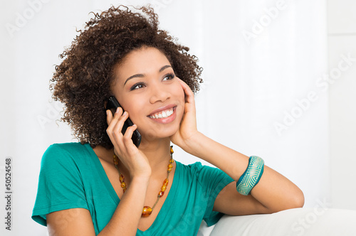 Photo: Happy Woman Talking On Cellphone Happy Woman Talking On Cellphone