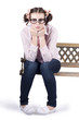 Lonely business girl sitting on park bench