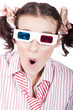 Amazed woman watching 3D movie in glasses