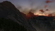 Mountain peaks at sunset, timelapse clouds