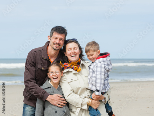 Photo: Family on the beach in summer Family on the beach in summer
