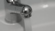 Clear water running from a faucet