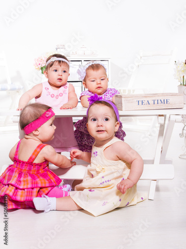 Photo: Babies group in festive clothing Babies group in festive clothing