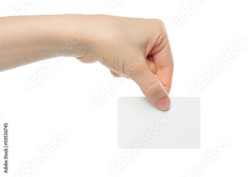 Photo: Hand holds business card on white background . Hand holds business card on white background .