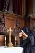 Nun in chapel