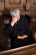 Priest with rosary