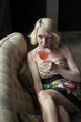 Blonde Woman Drinking a Pink Martini