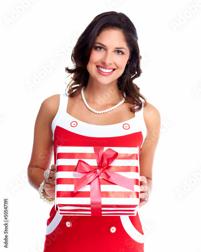 Photo: Beautiful young girl with a Christmas present. Beautiful young girl with a Christmas present.