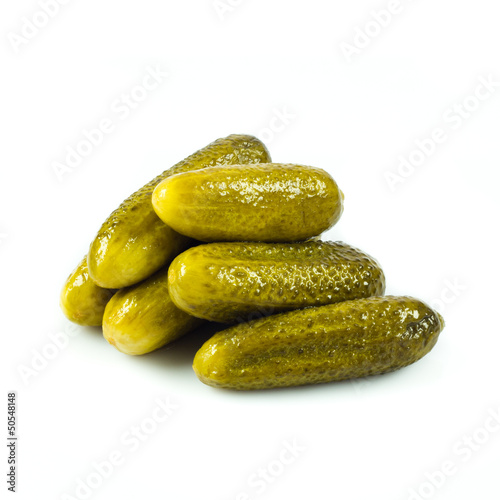 Photo: pickled cucumbers. Gherkins on a white background pickled cucumbers. Gherkins on a white background