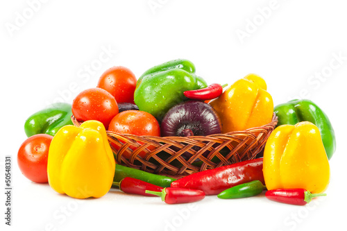 Photo: Fresh vegetables in basket isolated on white. Bio Vegetable. Co Fresh vegetables in basket isolated on white. Bio Vegetable. Co