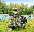 Photo: Paintball players in full gear at the shooting range Paintball players in full gear at the shooting range