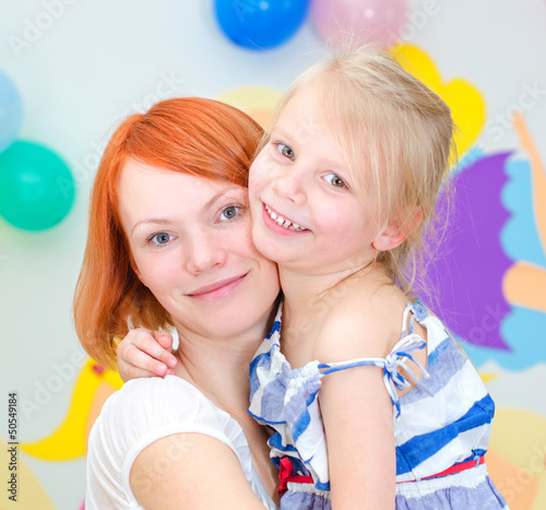 Photo: Happy mother with her smiling daughter Happy mother with her smiling daughter