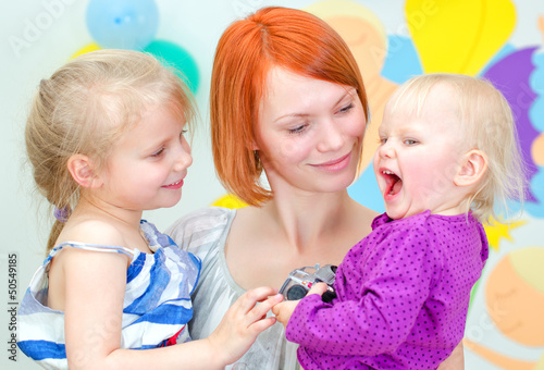 Photo: Happy mother with her two daughters Happy mother with her two daughters