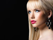 Portrait of young beautiful blonde woman with perfect makeup