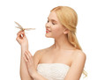 woman with butterfly in hand