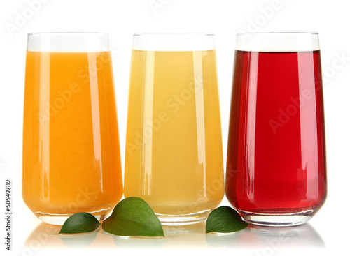 Photo: Glasses of juise and leafs isolated on white Glasses of juise and leafs isolated on white