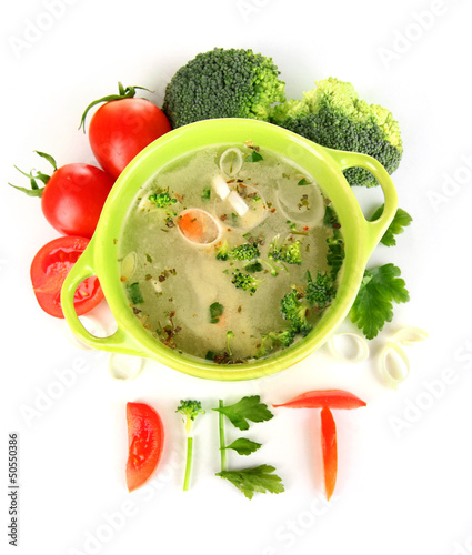 Photo: Diet soup with vegetables in pan isolated on white Diet soup with vegetables in pan isolated on white