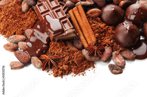 Photo: Composition of chocolate sweets, cocoa and spices, isolated Composition of chocolate sweets, cocoa and spices, isolated