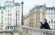 Happy couple laughing on the bridge