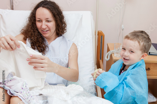 Photo: Son visiting mother in hospital Son visiting mother in hospital