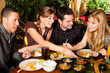 Photo: Young people eating in Thai restaurant Young people eating in Thai restaurant