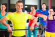 weight training in the gym with dumbbells
