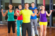 weight training in the gym with dumbbells