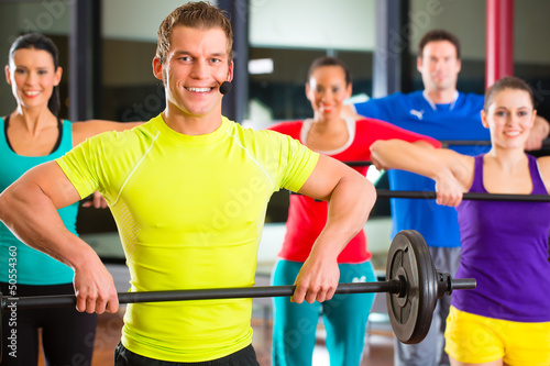 Photo: weight training in the gym with dumbbells weight training in the gym with dumbbells
