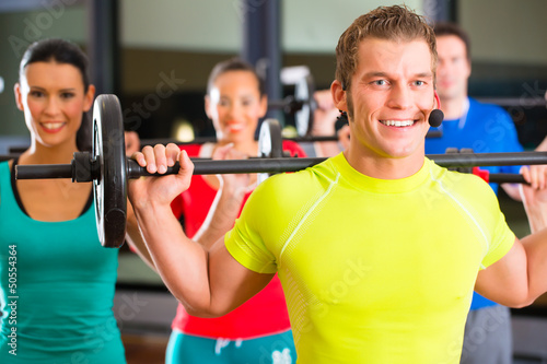 Photo: weight training in the gym with dumbbells weight training in the gym with dumbbells