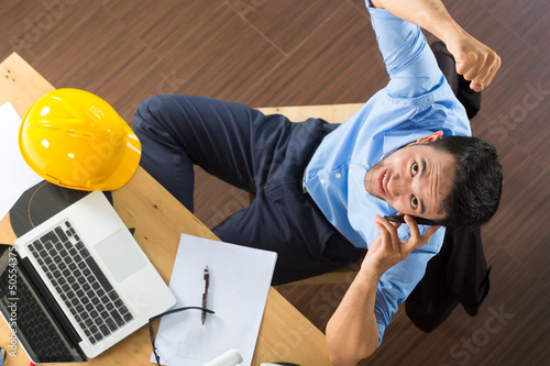 Photo: Architect working at home Architect working at home