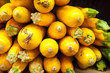 Golden Zucchini Stacked for Sale at a Market