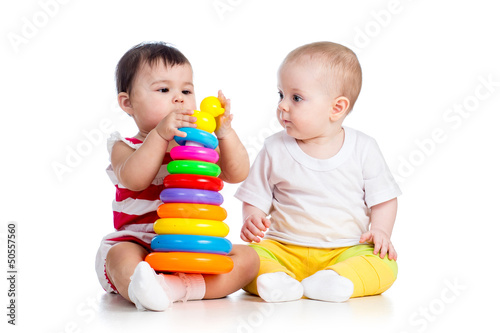 Photo: kids girls playing toy together kids girls playing toy together