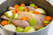 Organic raw guinea fowl prepared to be cooked as a broth