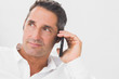 Photo: Man phoning and looking away Man phoning and looking away