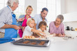 Photo: Family preparing biscuits together Family preparing biscuits together