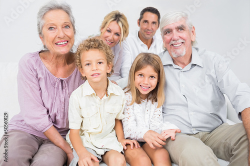 Photo: Smiling family posing for a picture Smiling family posing for a picture