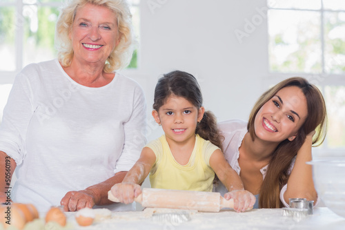 Photo: Happy women of a family baking together Happy women of a family baking together
