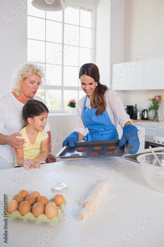 Photo: Girl looking at home-made cookies Girl looking at home-made cookies