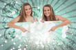 Pretty girls pointing to advertisement card