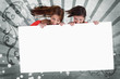 Pretty girls looking down at white copy space screen