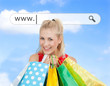 Photo: Happy blonde with her shopping bags under address bar Happy blonde with her shopping bags under address bar