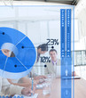 Serious business people using blue pie chart interface